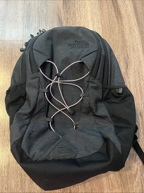 The NorthFace Jester Black Backpack with Light Pink Bungee Cord